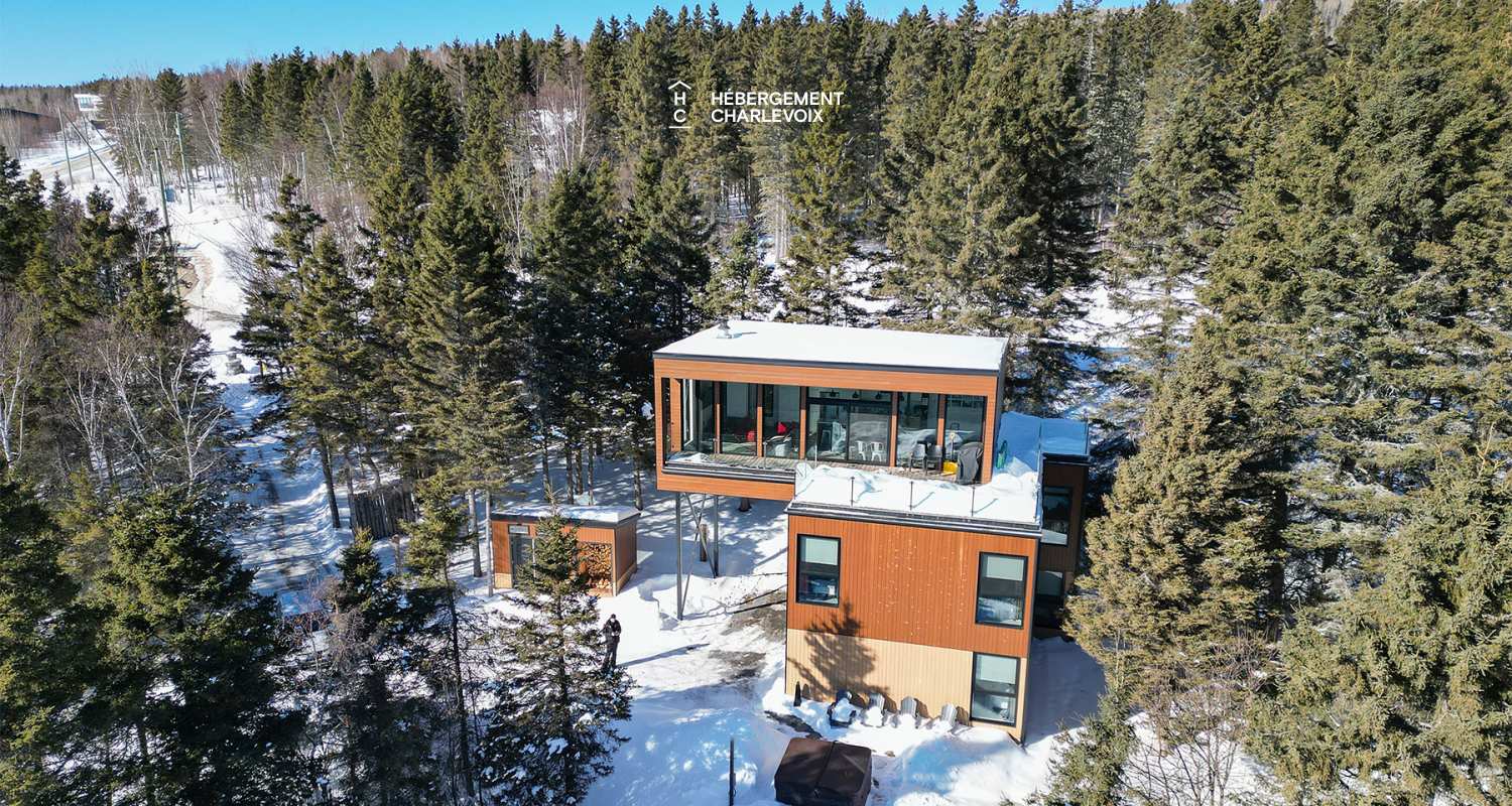 ABS-595 - Un feu de foyer suspendu dans un chalet de luxe à louer dans Charlevoix.